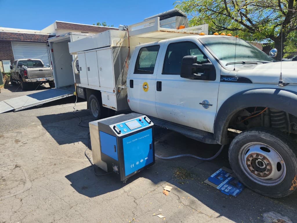 Mobile DPF cleaning service truck with cleaning equipment set up on site